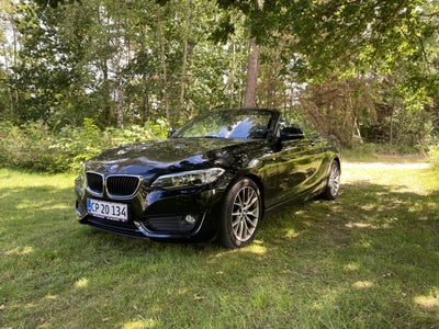 BMW 218i 1,5 Cabriolet aut. Benzin aut. Automatgear modelår 2015 km 82000 Sortmetal ABS airbag servi