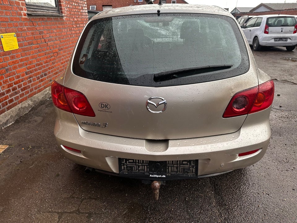 Mazda 3 1,6 Touring 4d