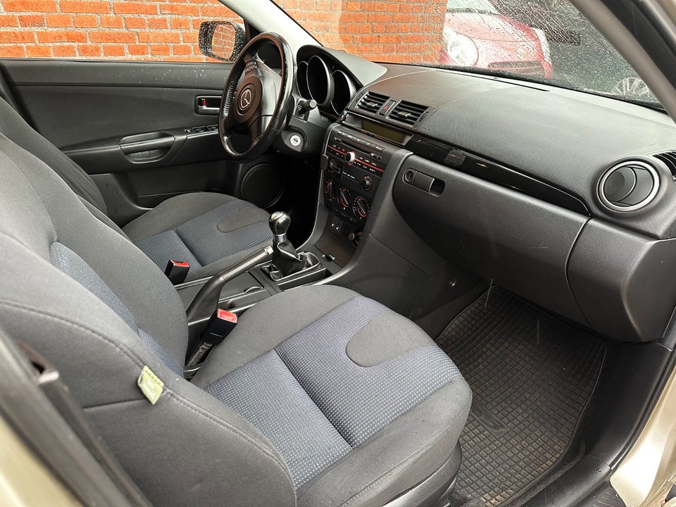 Mazda 3 1,6 Touring 4d