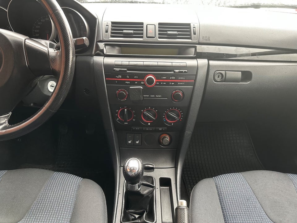 Mazda 3 1,6 Touring 4d