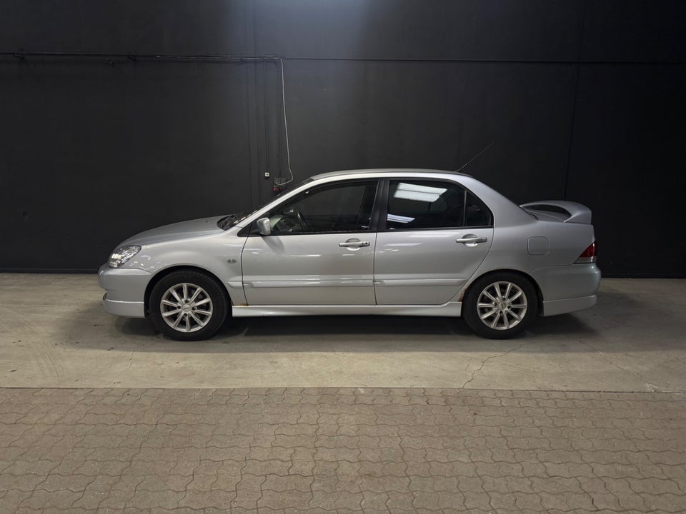 Mitsubishi Lancer 1,6 Invite 4d